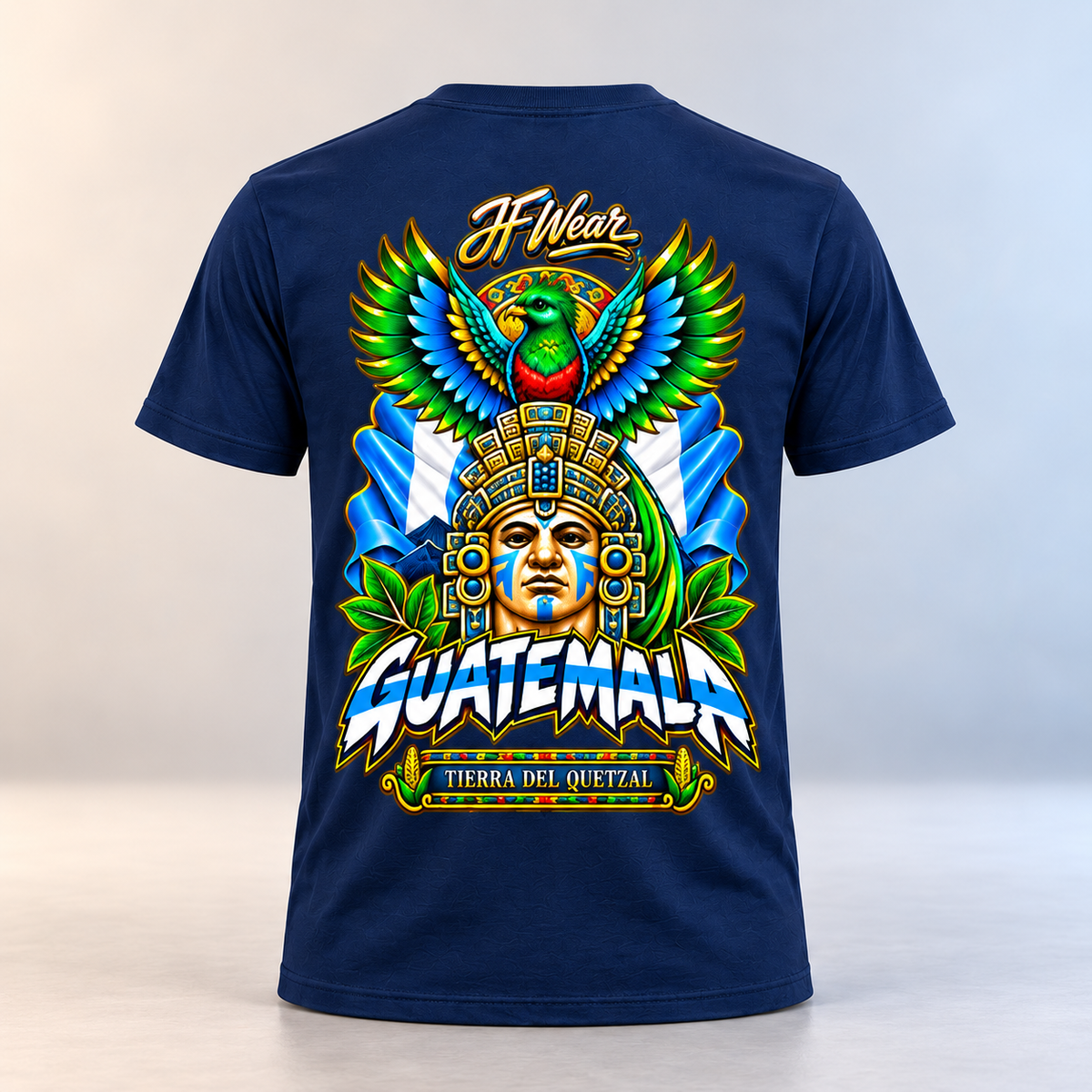 A navy blue short-sleeve t-shirt shown from the back, featuring a large, colorful graphic print with a Guatemalan face in a headdress, a green and blue bird, and the text 'JF Wear' and 'GUATEMALA'.