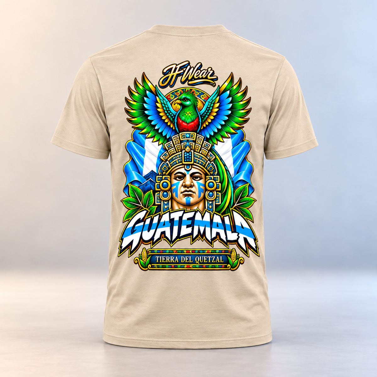 A beige crewneck t-shirt shown from the back, featuring a large, colorful graphic print with a Guatemalan face, an eagle, and the text 'JF Wear' and 'GUATEMALA'.