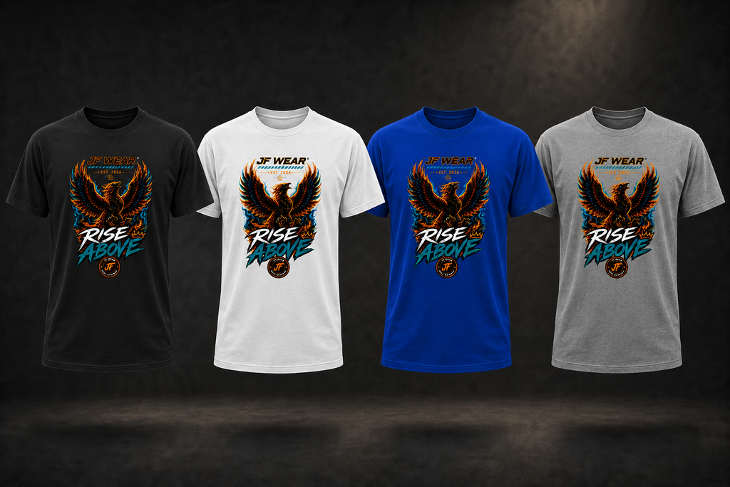 Four short-sleeve graphic T-shirts shown side by side on a dark studio background: black, white, blue, and heather gray. Each shirt features a large eagle graphic with the text 'RISE ABOVE' and a small 'JE WEAR' logo above the print.